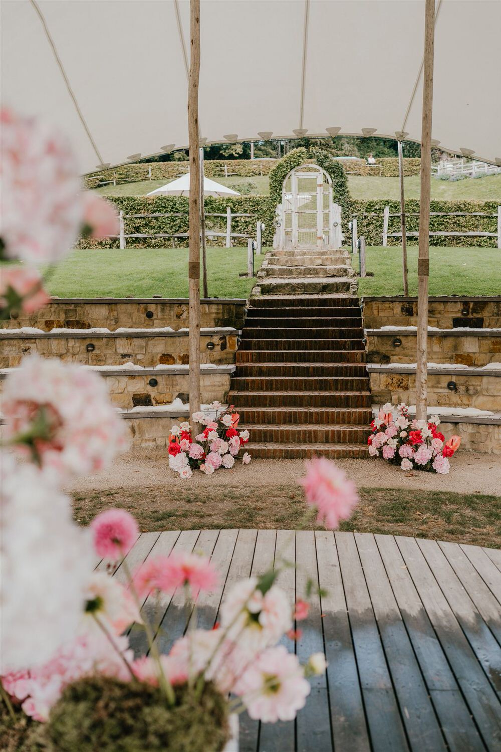 pink flowers at at the beacon tunbridge wells wedding ceremony