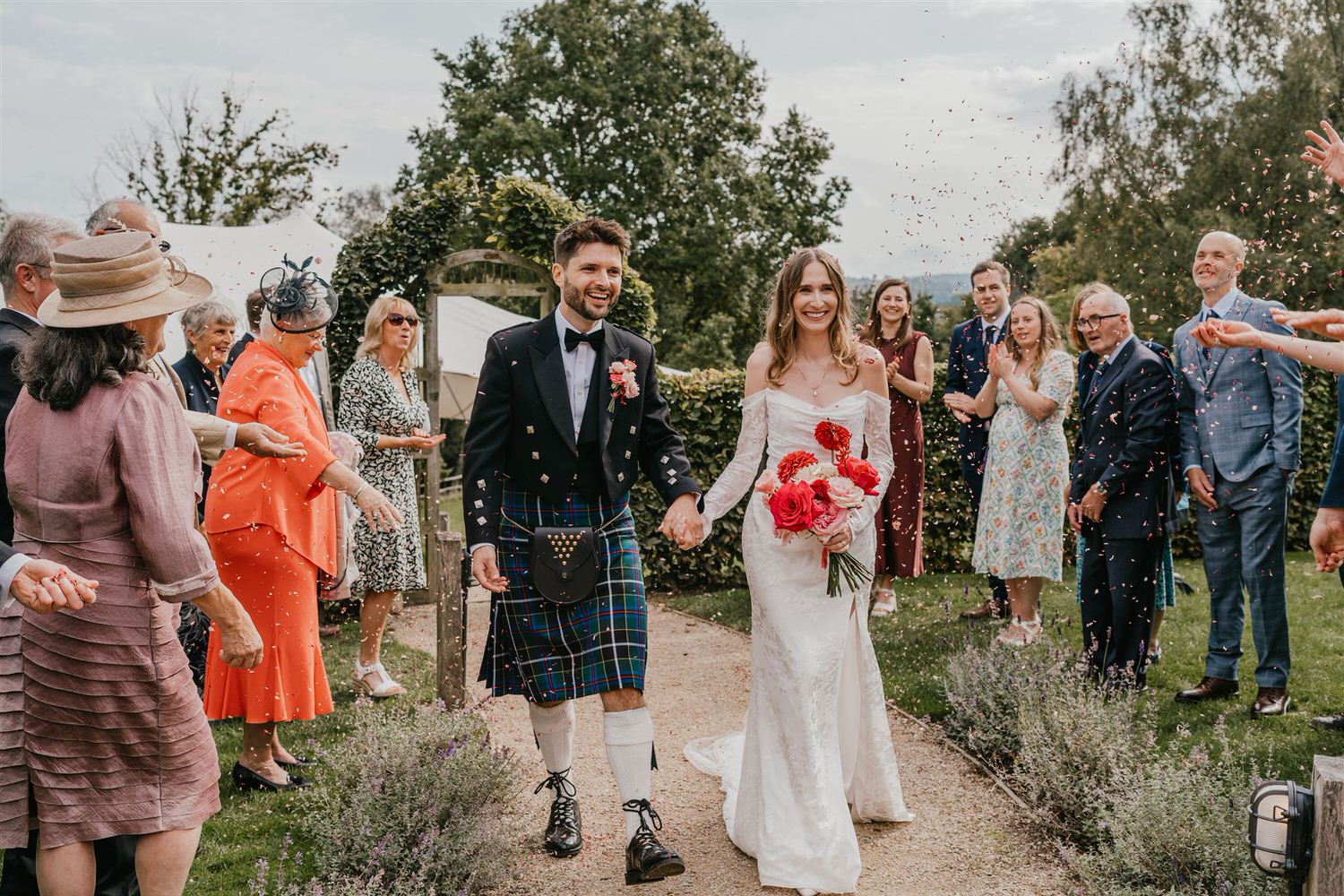 bride and groom confetti moment at the beacon tunbridge wells wedding venue in kent