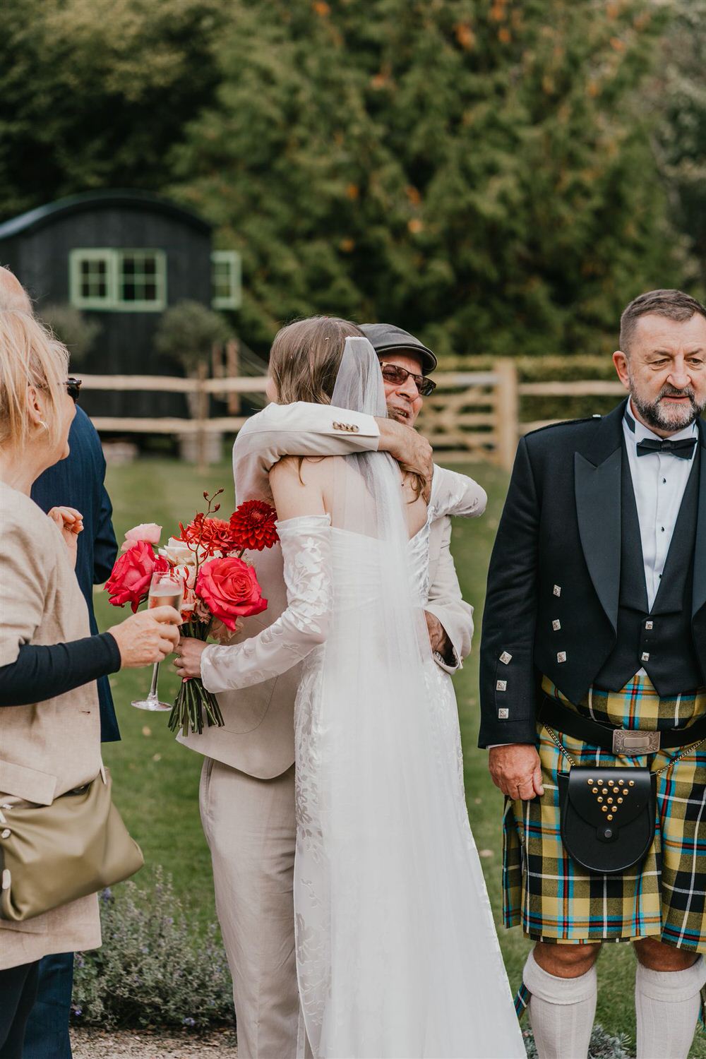 bride hugs guest at the beacon tunbridge wells wedding