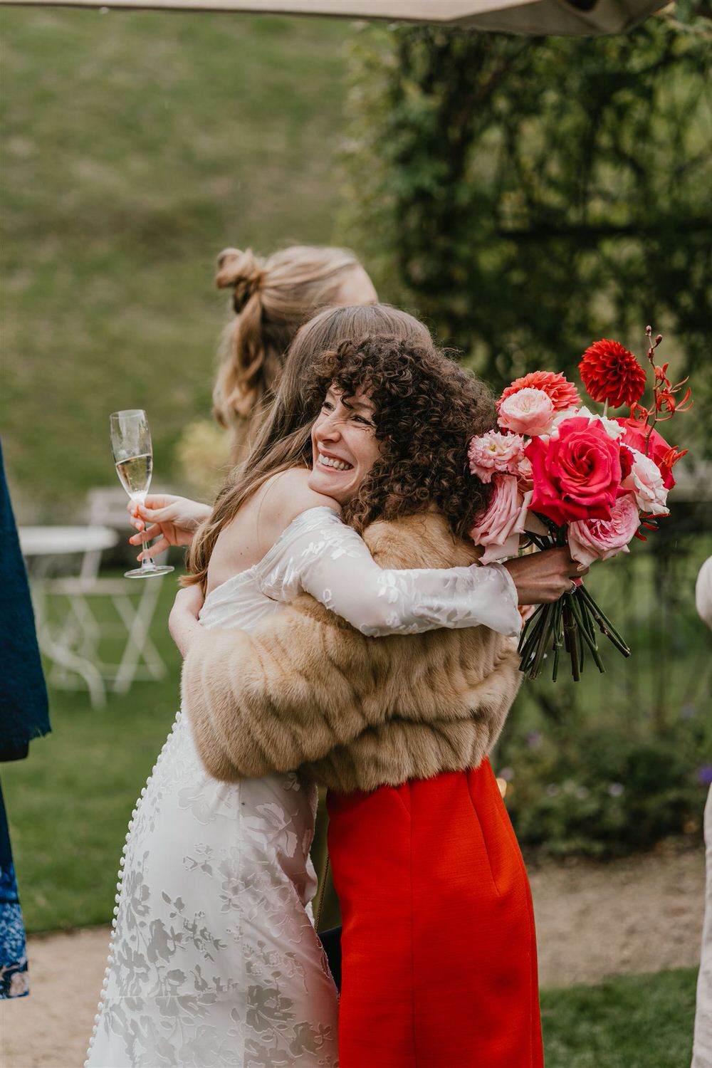 bride hugs guest at the beacon tunbridge wells wedding