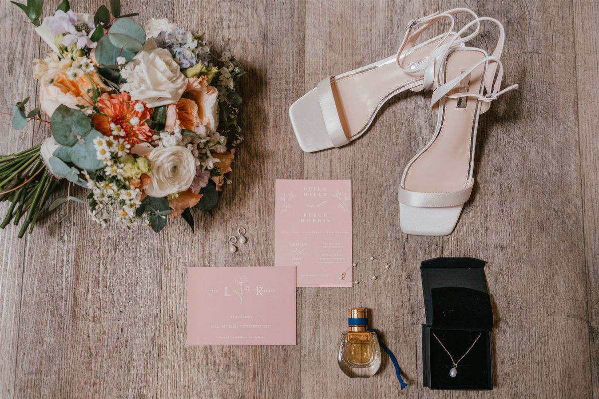 bridal details laid out on wooden floor