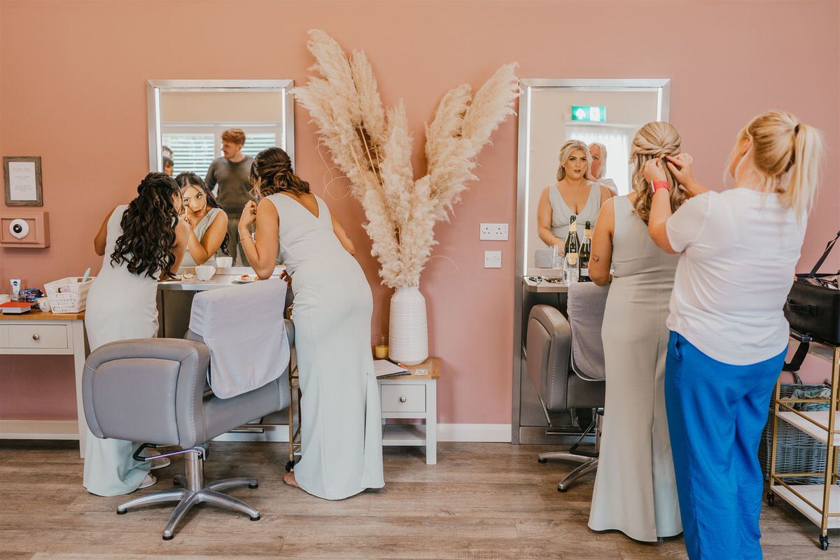 bridal party getting ready in preparation suite at winters barns wedding venue in canterbury