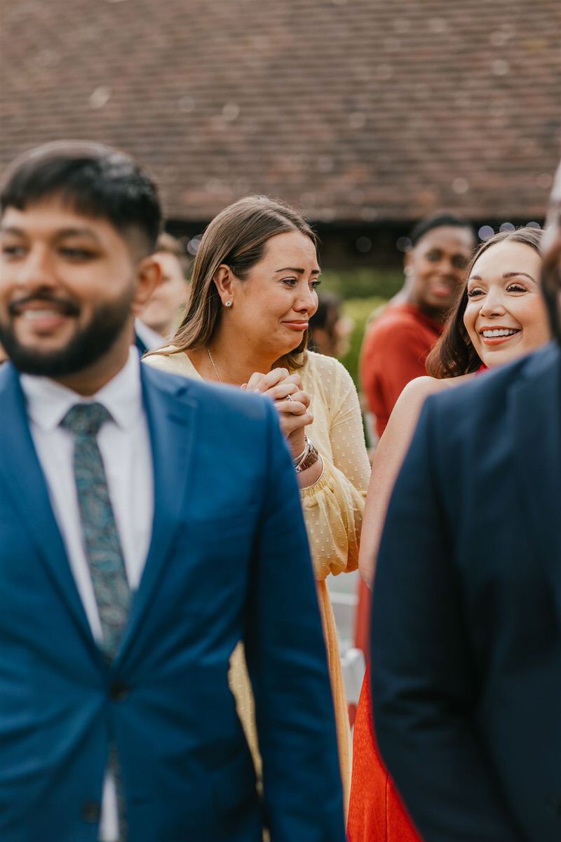 guest getting emotional during outdoor ceremony at winters barns wedding