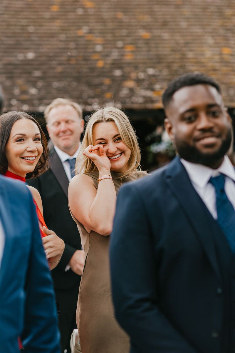 guest getting emotional during outdoor ceremony at winters barns wedding