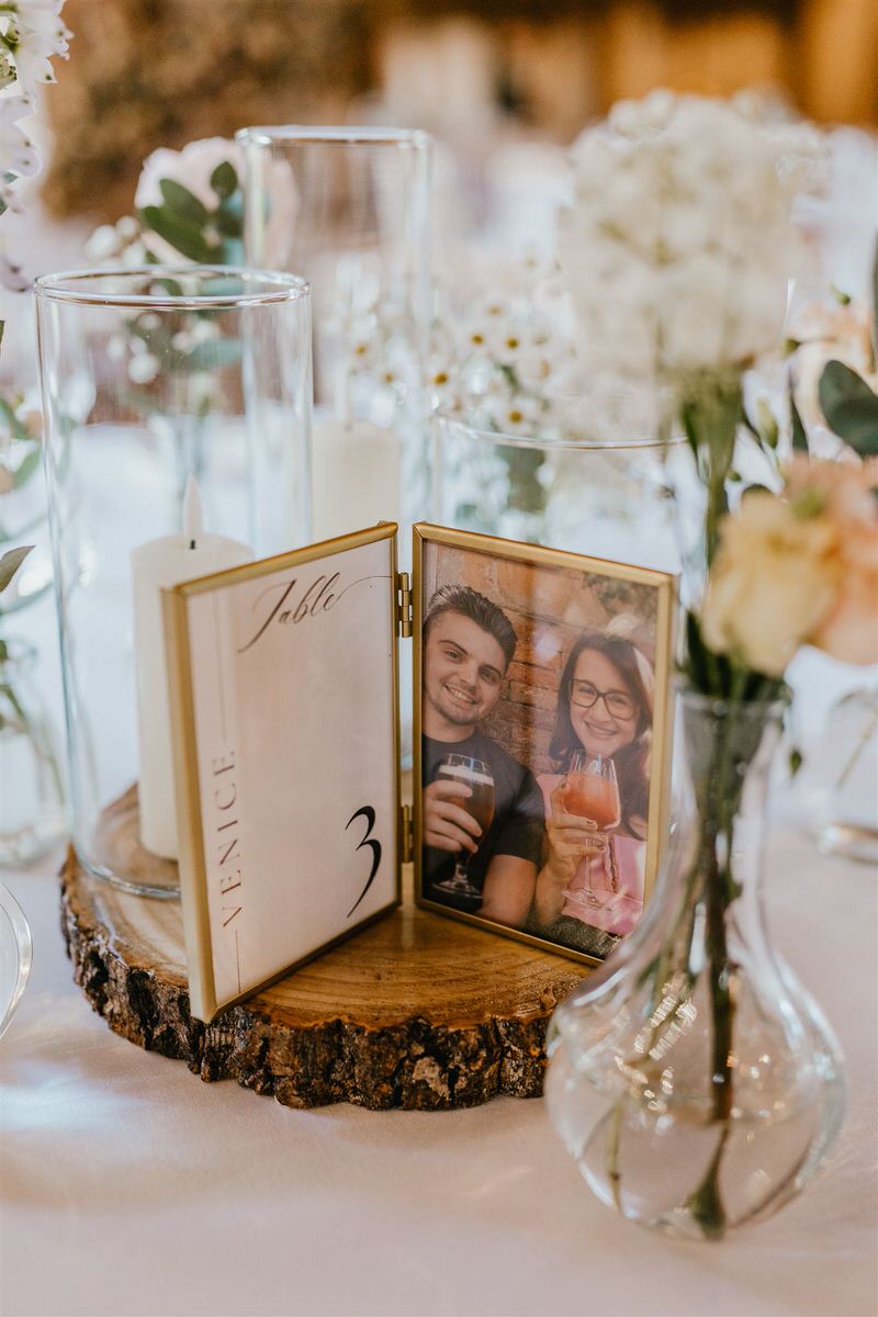 photo table centrepiece at winters barns wedding