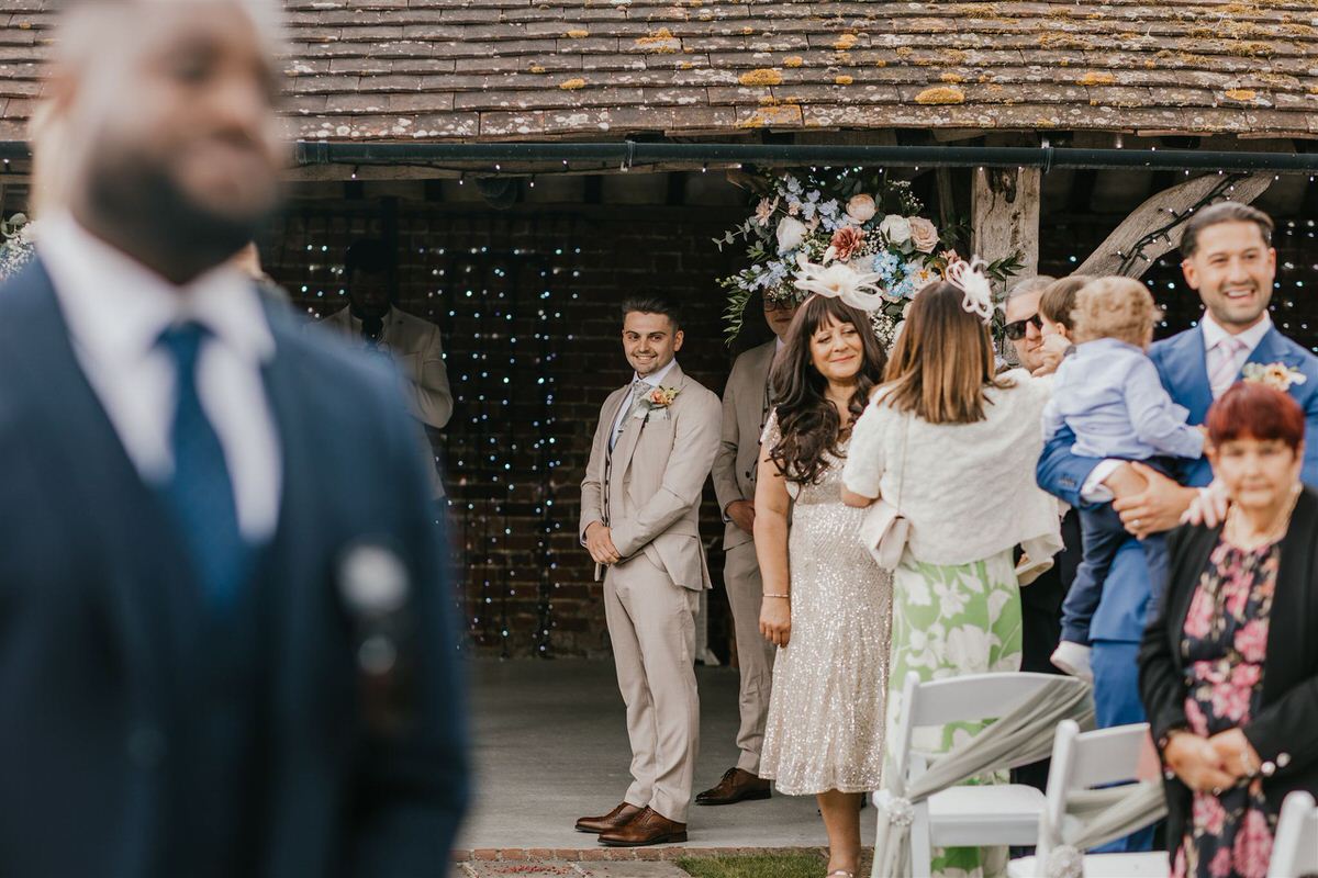 groom waiting for bride during outdoor ceremony at winters barns wedding