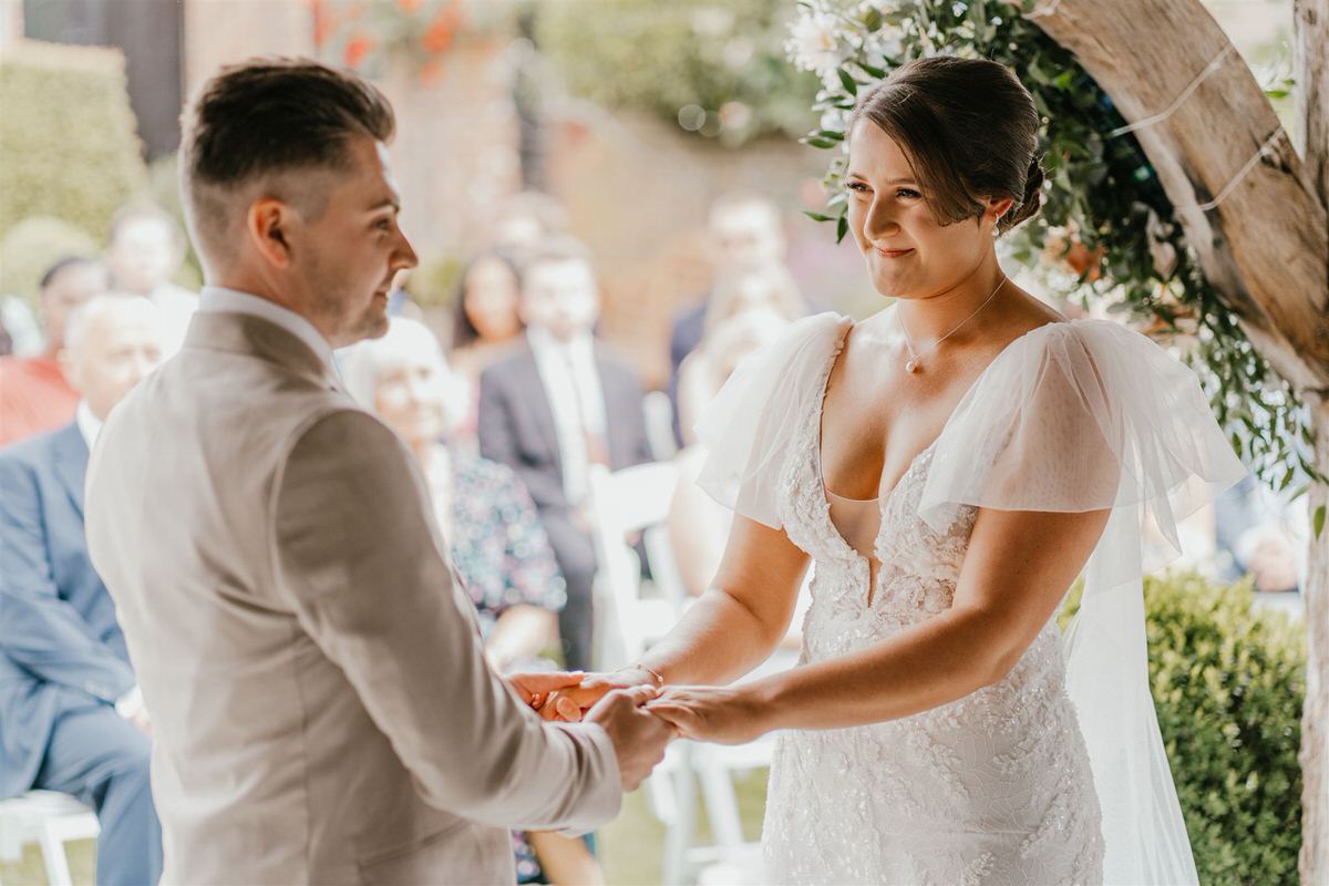 bride and groom during outdoor winters barns wedding ceremony