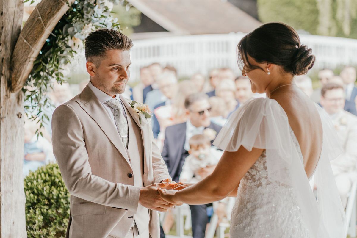 bride and groom during outdoor winters barns wedding ceremony