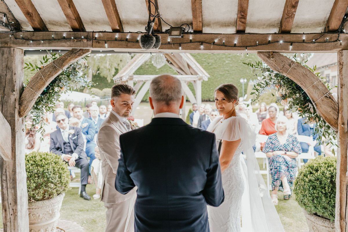 bride and groom during outdoor winters barns wedding ceremony