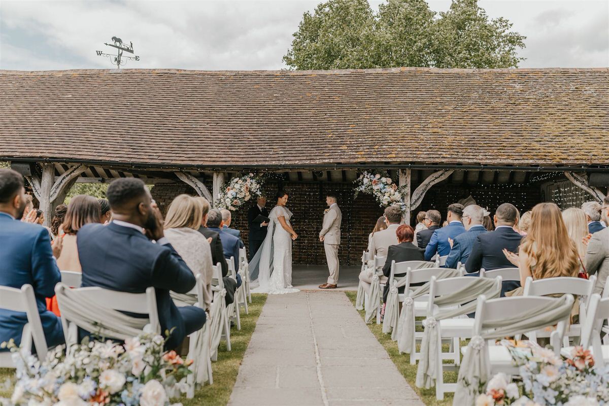 bride and groom during outdoor winters barns wedding ceremony