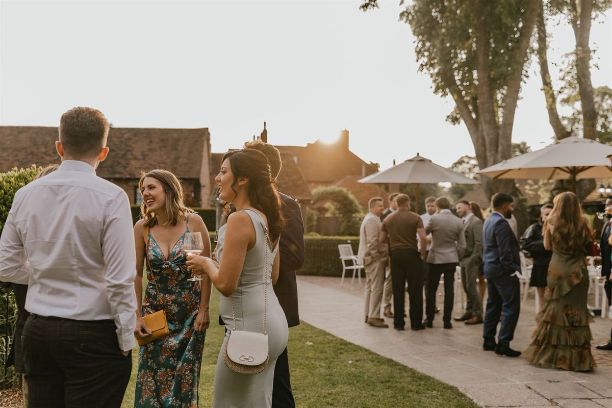 wedding guests during golden hour at winters barns wedding reception