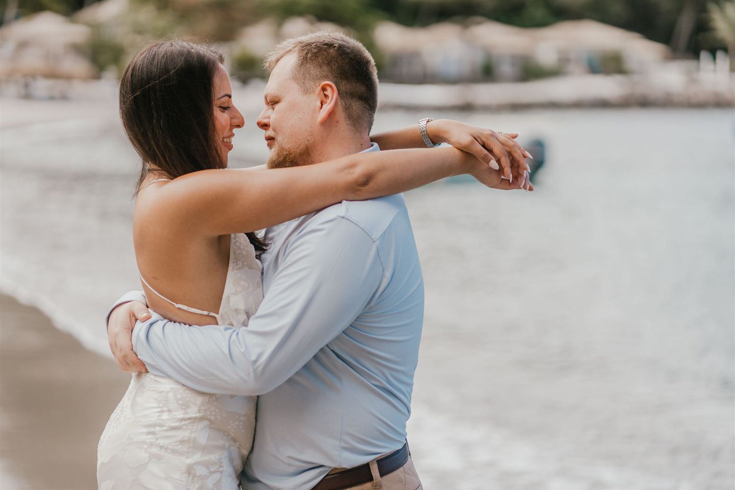 couple embracing on sugar beach in saint lucia destination photography