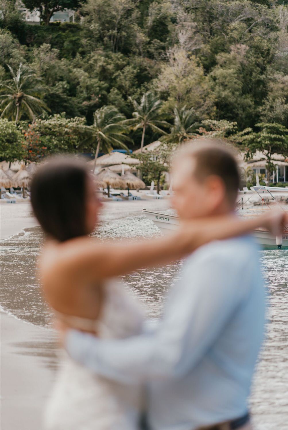 couple embracing on sugar beach in saint lucia destination photography