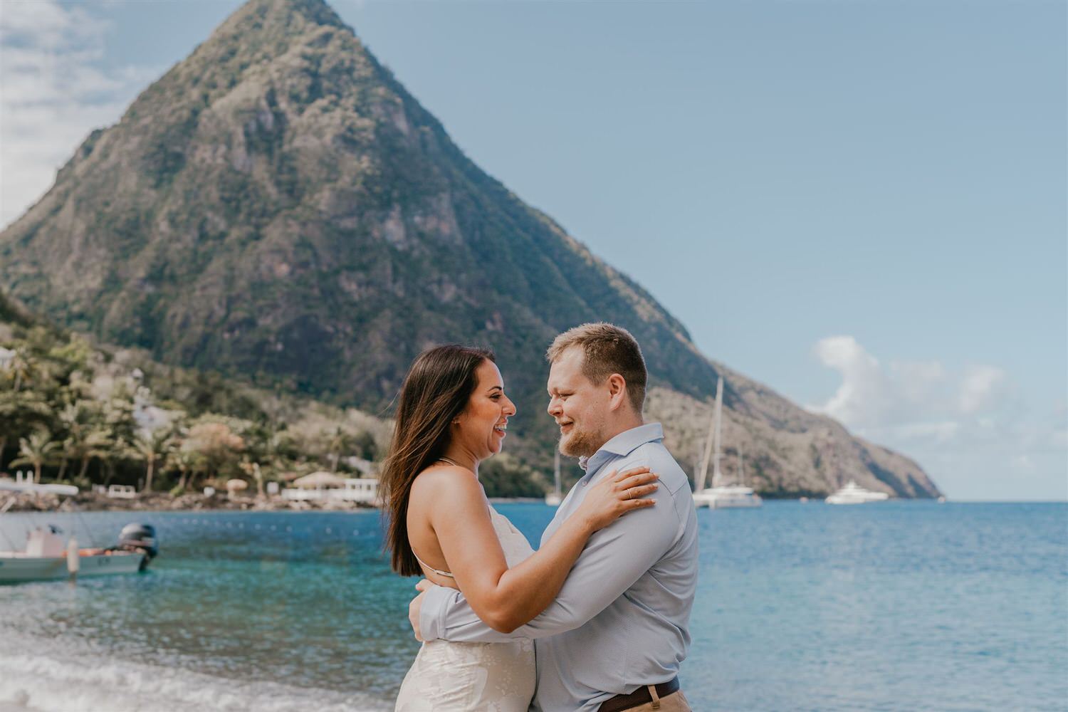 couple embracing on sugar beach in saint lucia destination photography