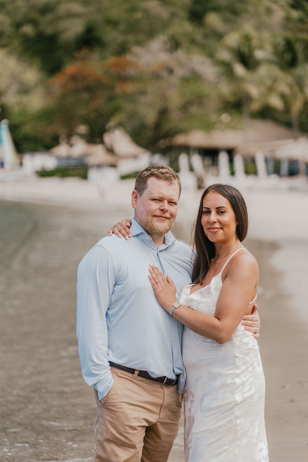 couple embracing on sugar beach in saint lucia destination photography