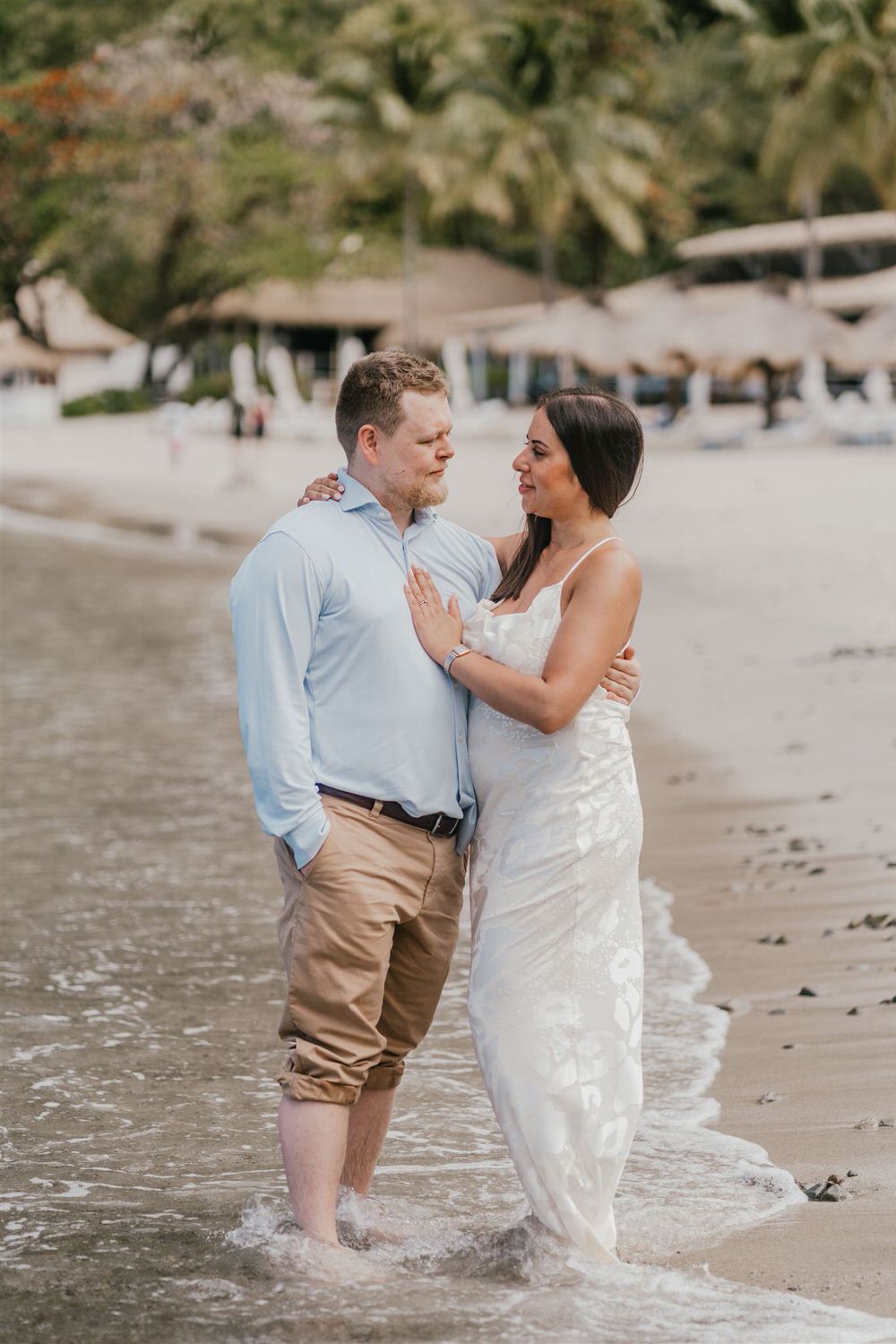 couple embracing on sugar beach in saint lucia destination photography