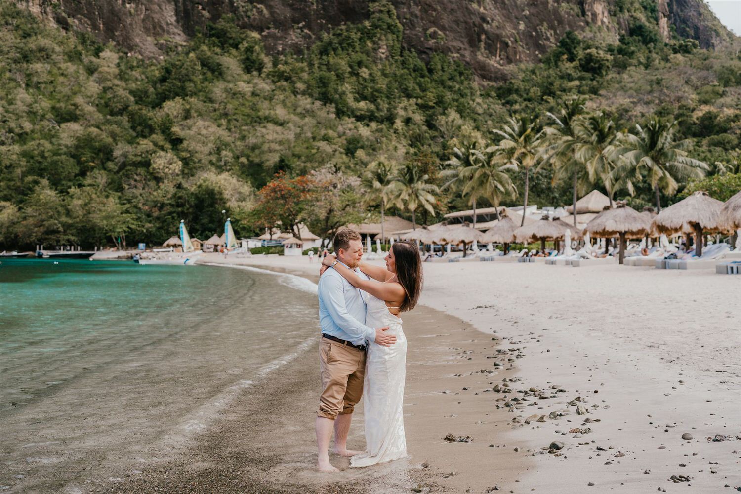 couple embracing on sugar beach in saint lucia destination photography