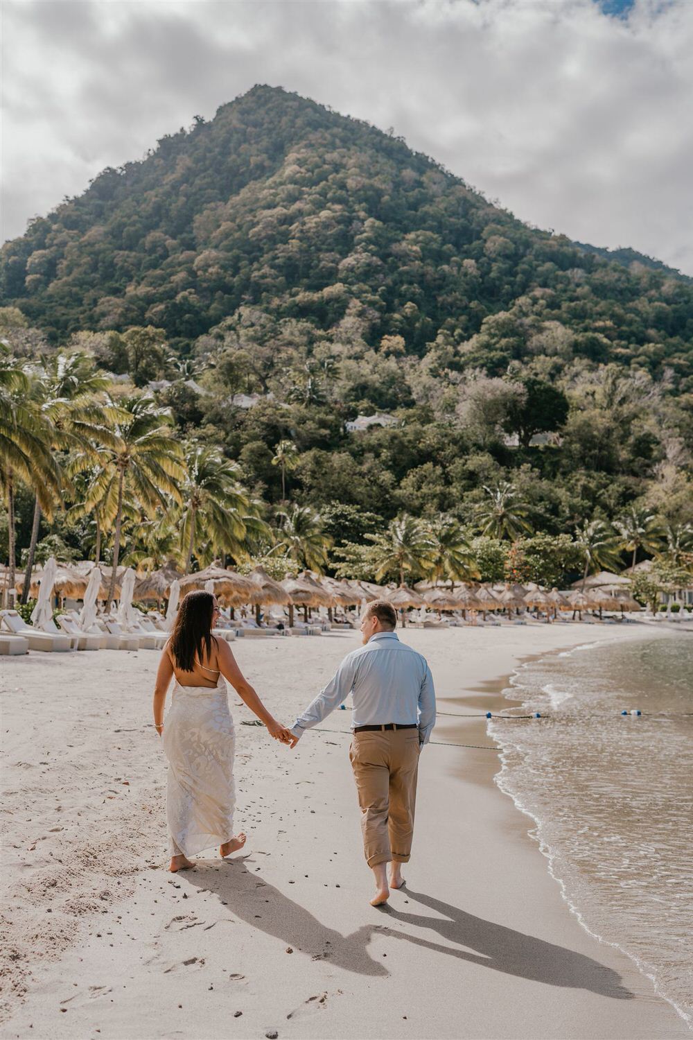 couple walking along sugar beach in saint lucia destination photography