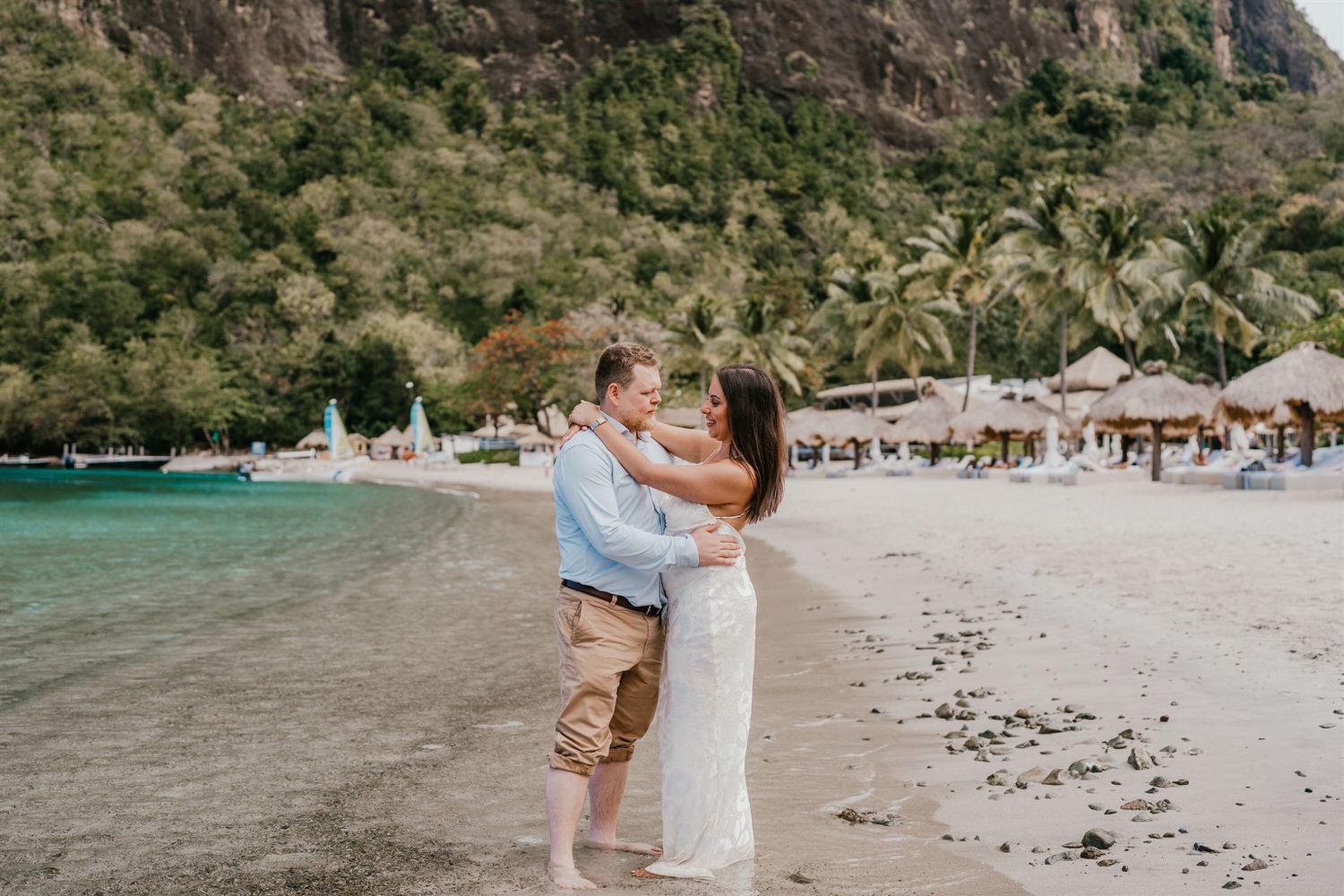 couple embracing on sugar beach in saint lucia destination photography