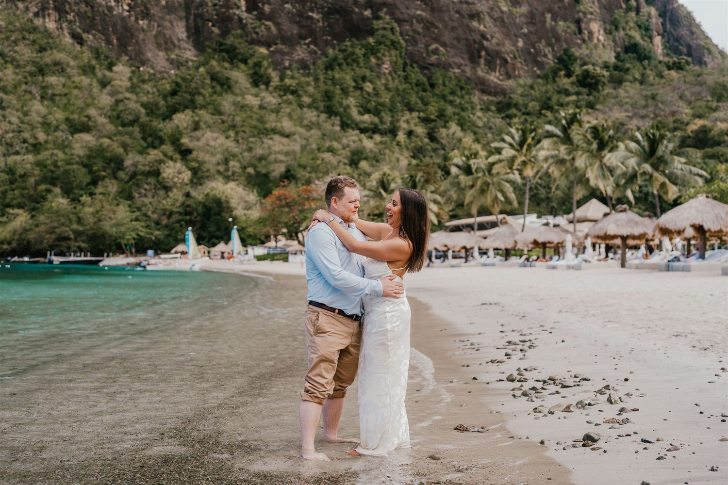 couple embracing on sugar beach in saint lucia destination photography