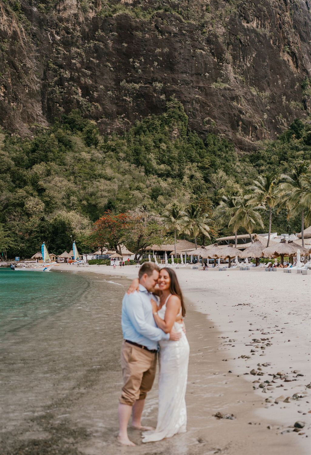 couple embracing on sugar beach in saint lucia destination photography