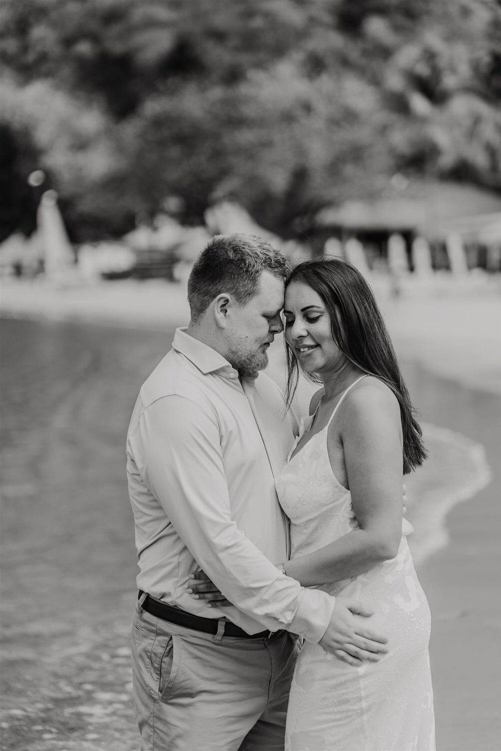 black and white photo of couple embracing on sugar beach in saint lucia destination photography