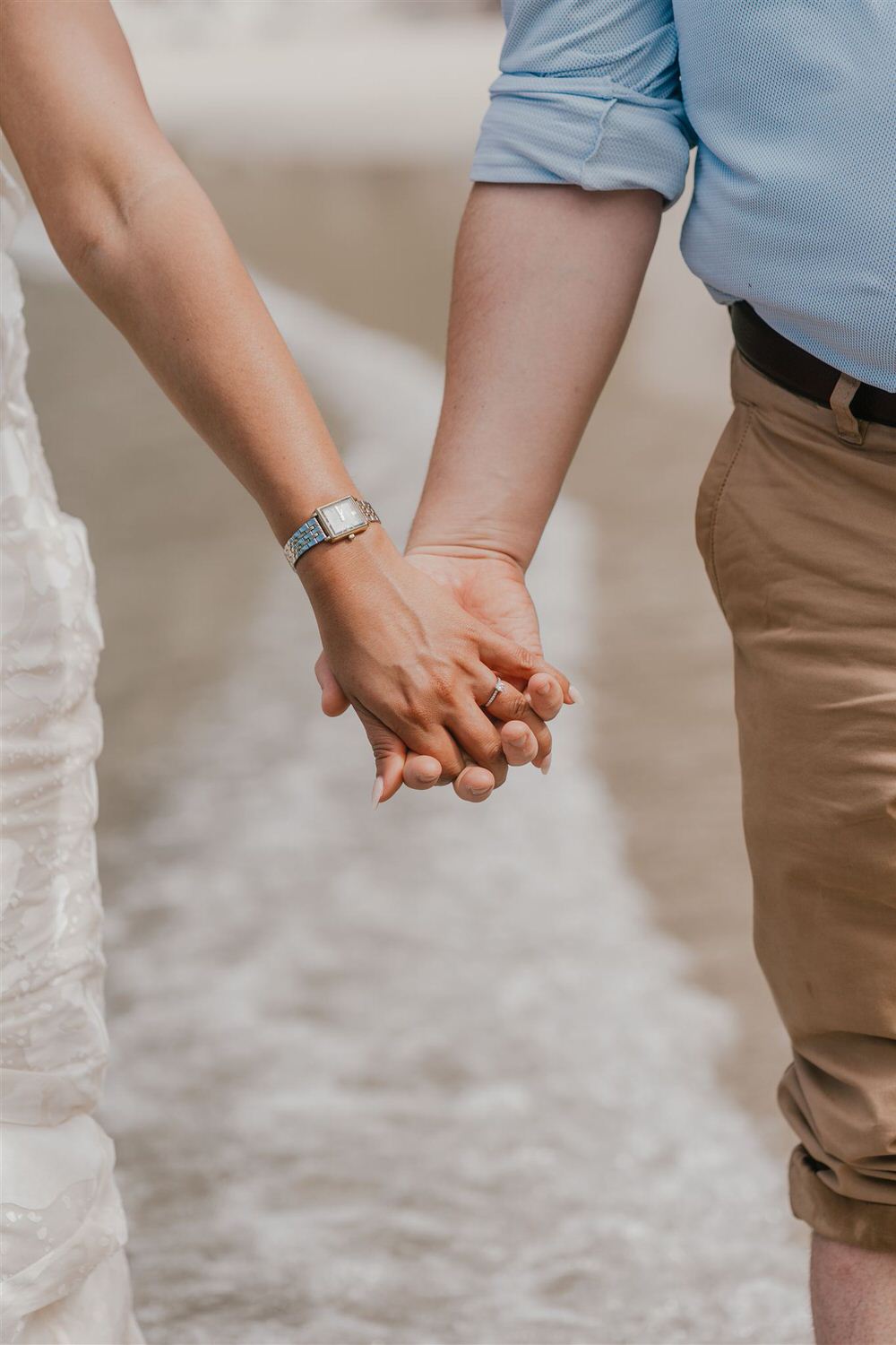 couple holding hands on sugar beach in saint lucia destination photography