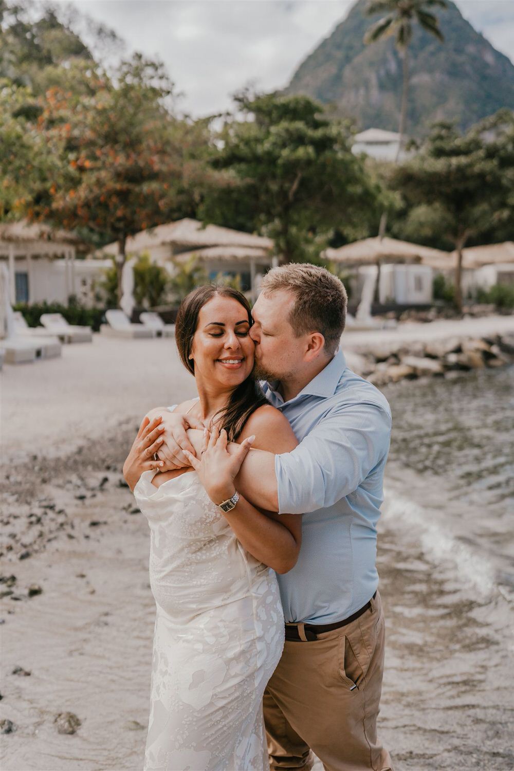 couple embracing on sugar beach in saint lucia destination photography