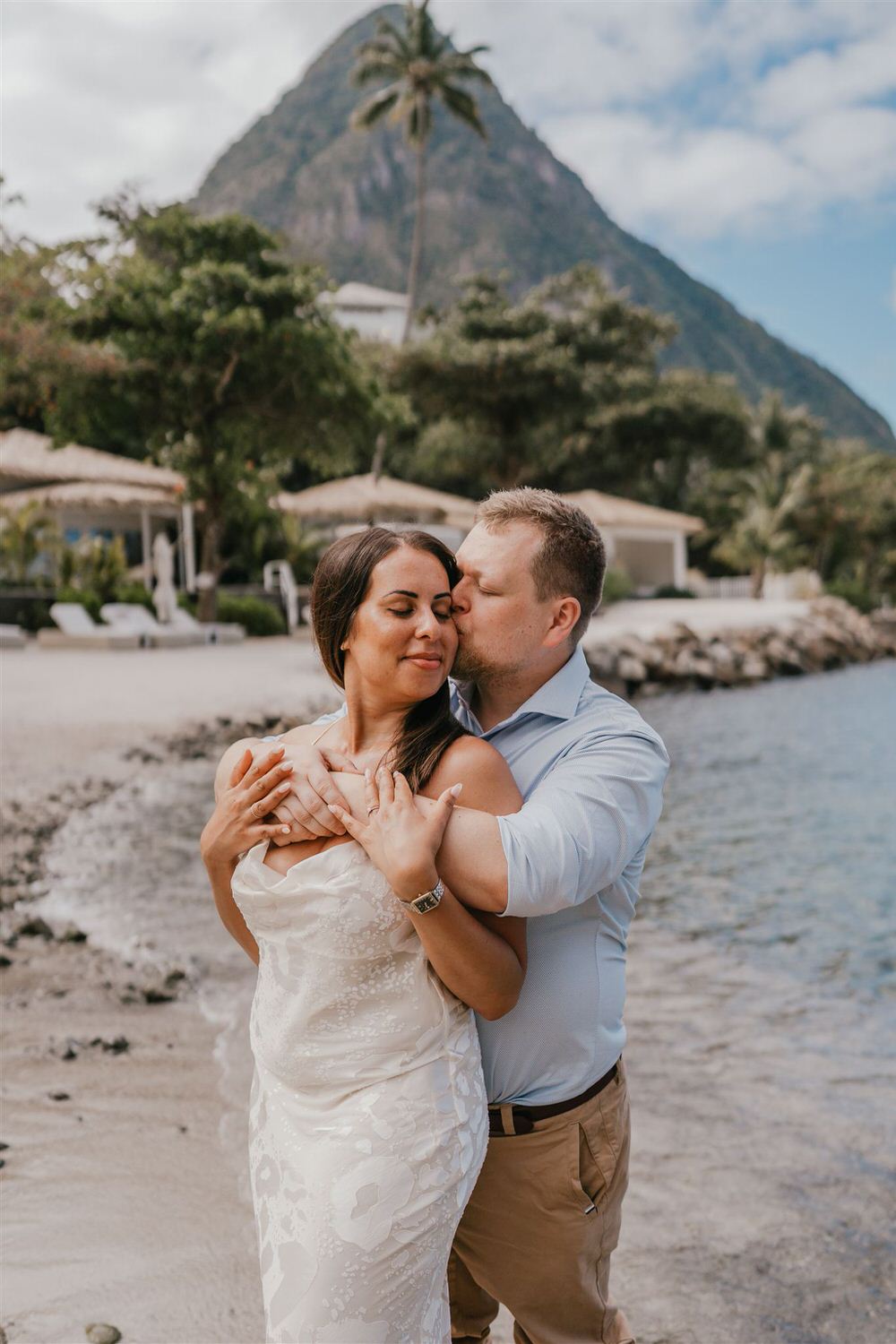 couple embracing on sugar beach in saint lucia destination photography