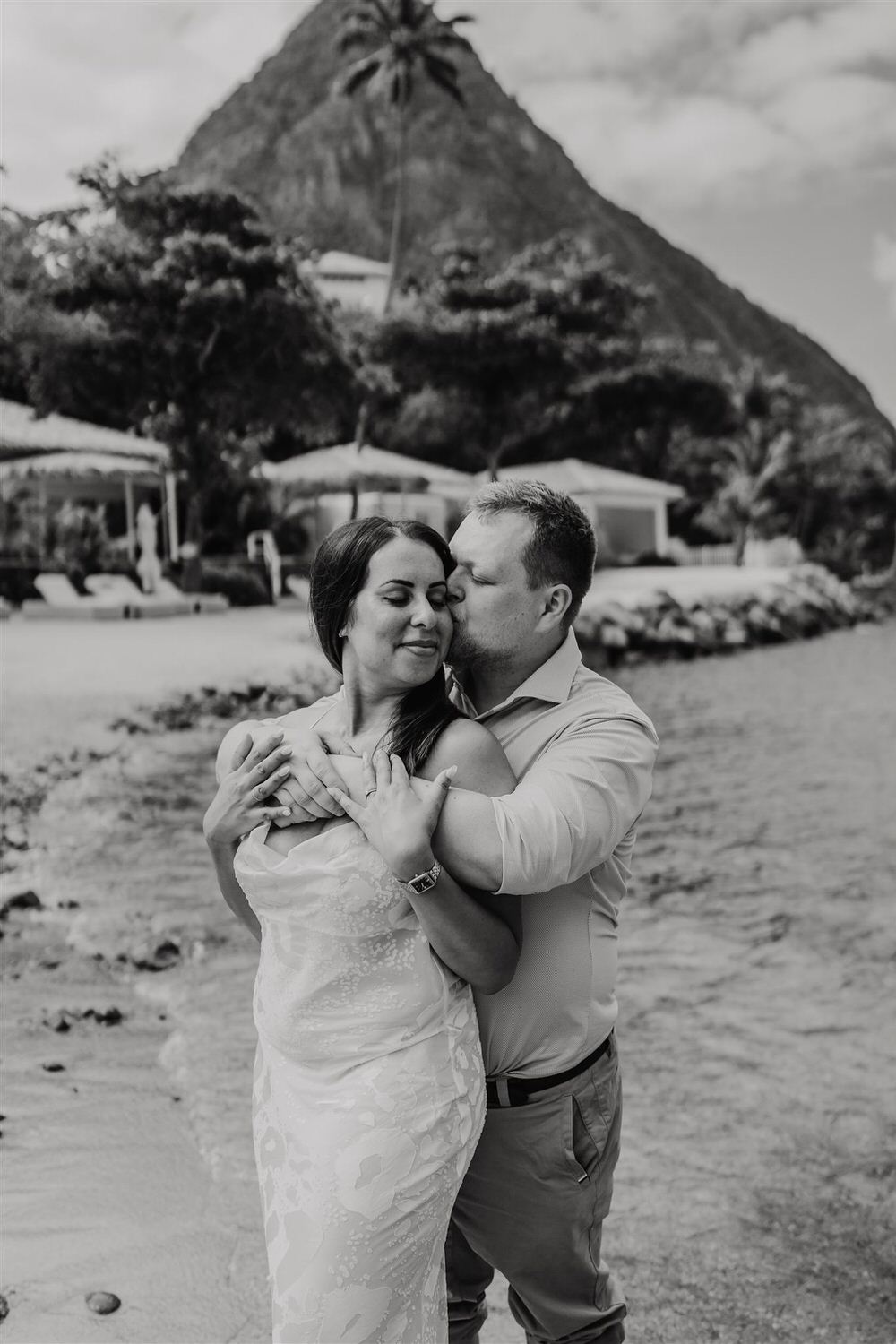black and white picture of couple embracing on sugar beach in saint lucia destination photography