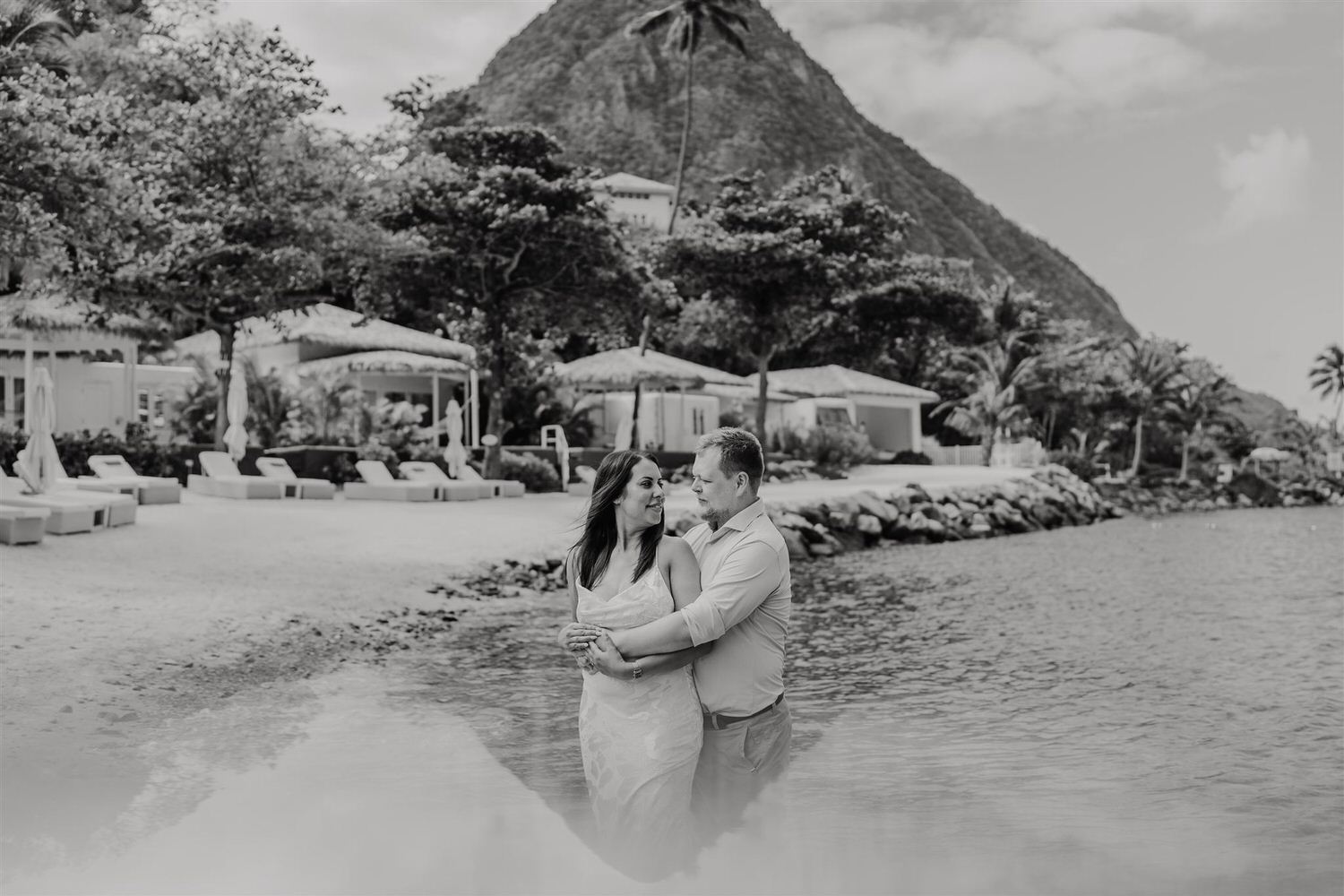 black and white photo of couple embracing on sugar beach in saint lucia destination photography