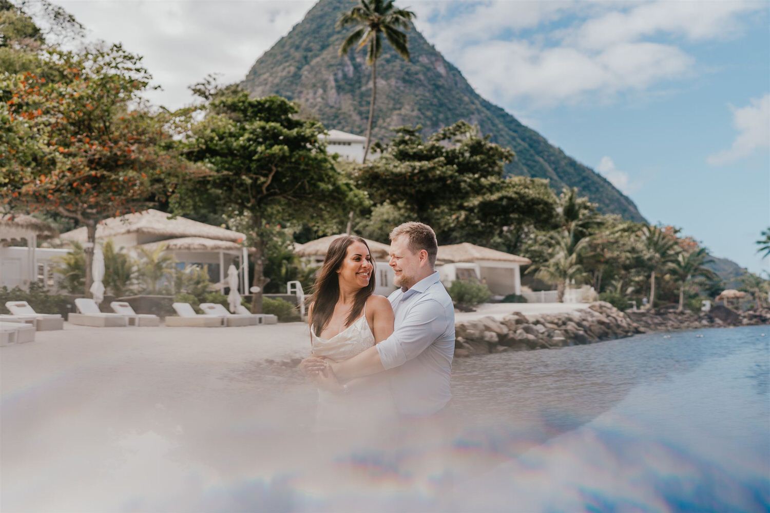 couple embracing on sugar beach in saint lucia destination photography