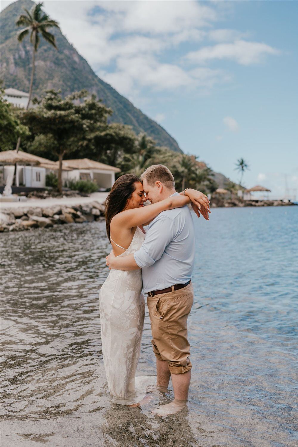 couple embracing on sugar beach in saint lucia destination photography