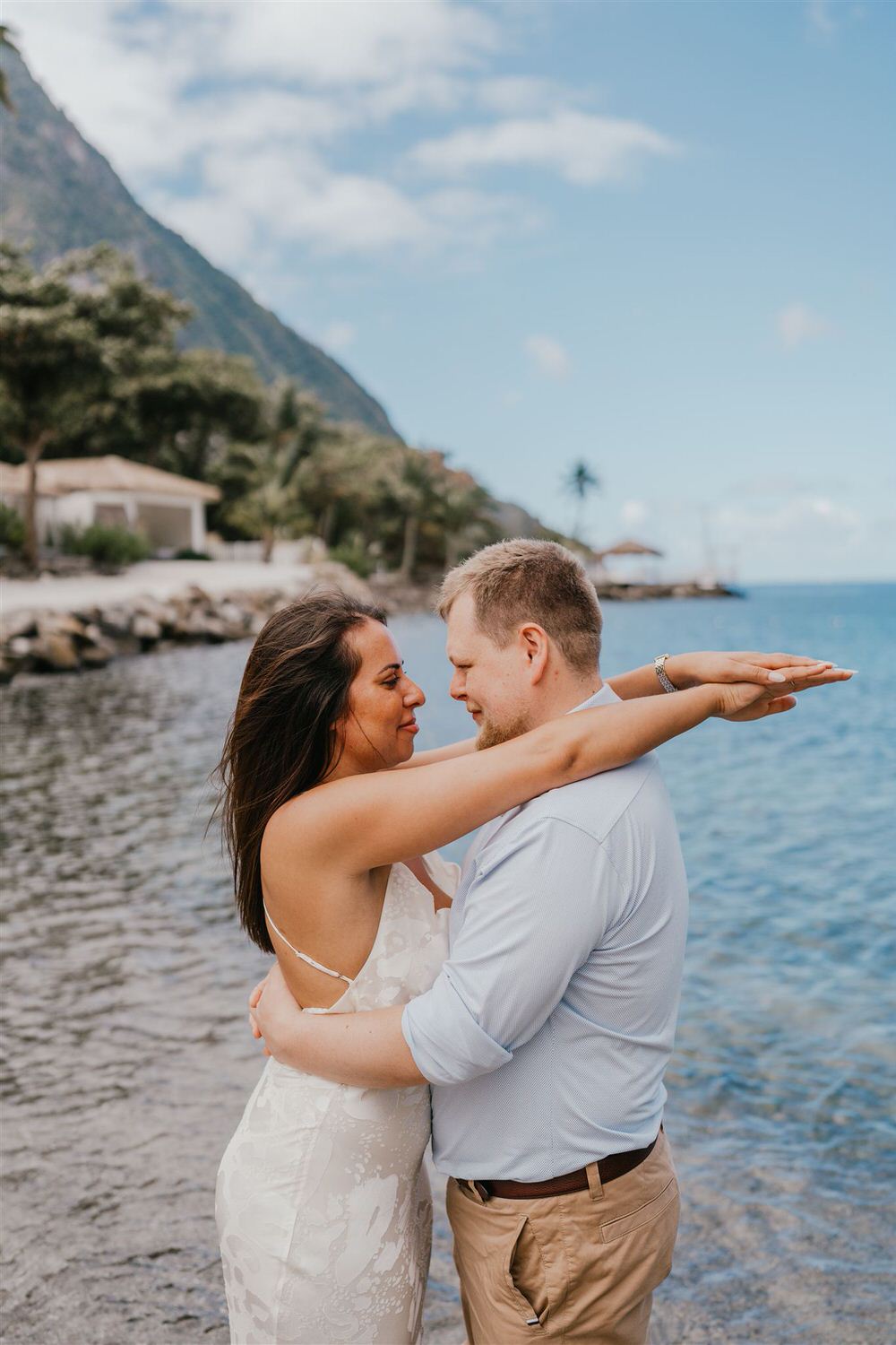 couple embracing on sugar beach in saint lucia destination photography