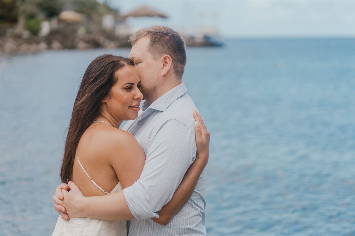couple embracing on sugar beach in saint lucia destination photography