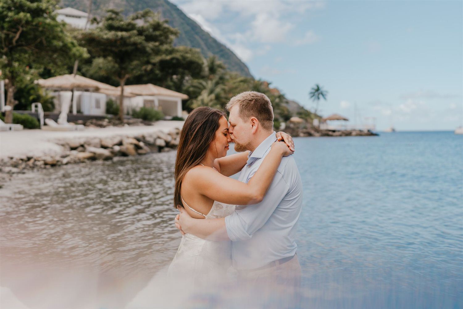 couple embracing on sugar beach in saint lucia destination photography