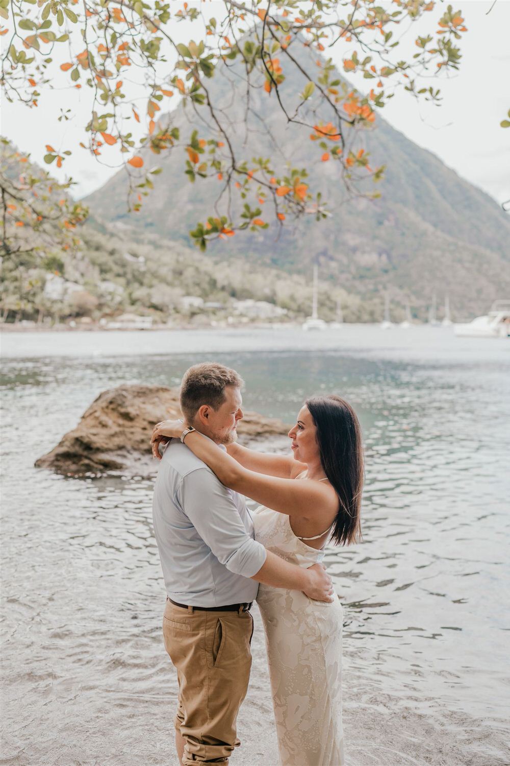 couple embracing on sugar beach in saint lucia destination photography