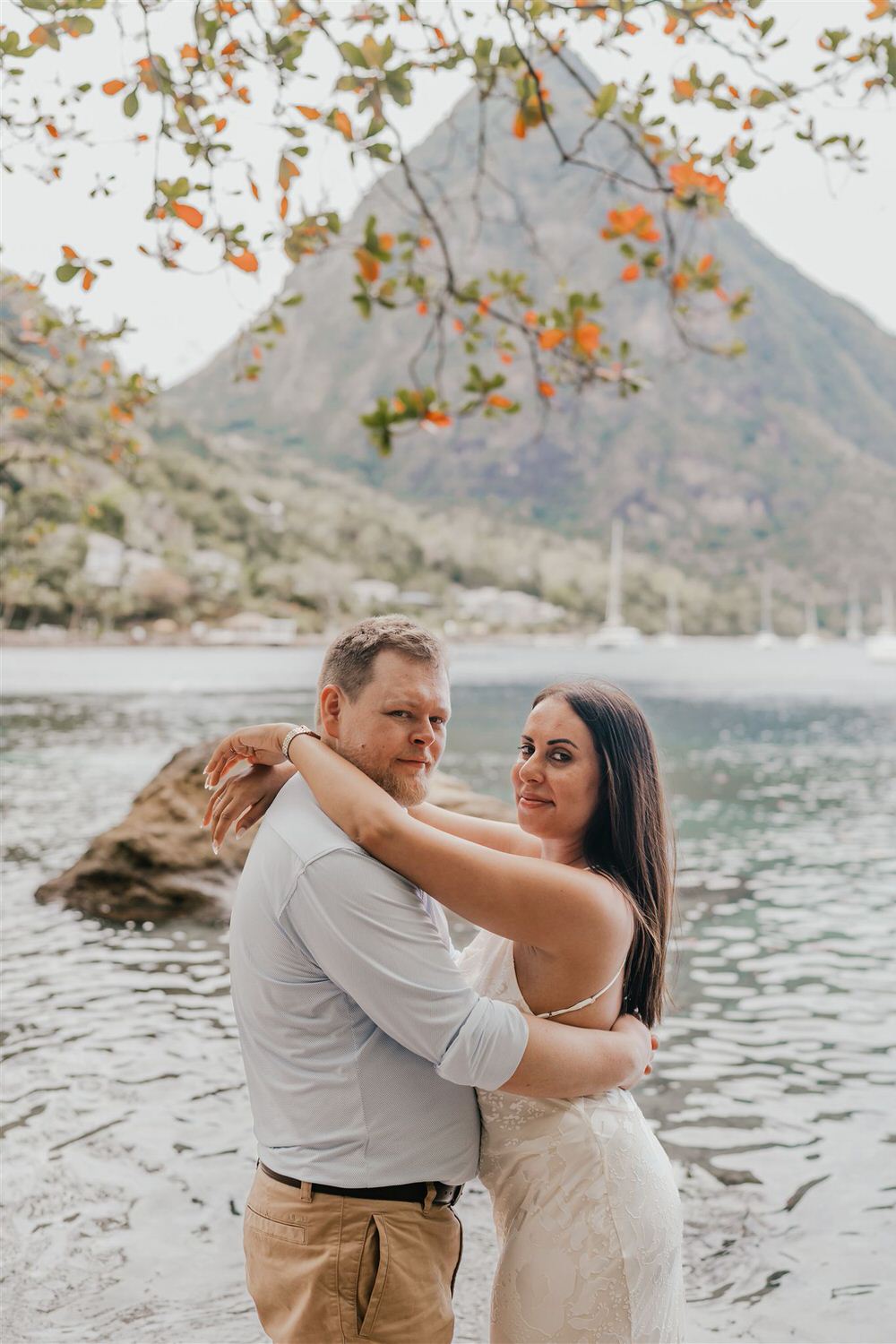 couple embracing on sugar beach in saint lucia destination photography