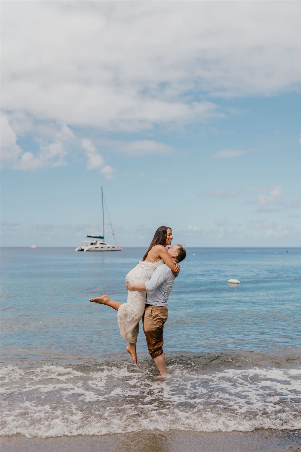 couple in the sea on sugar beach in saint lucia destination photography