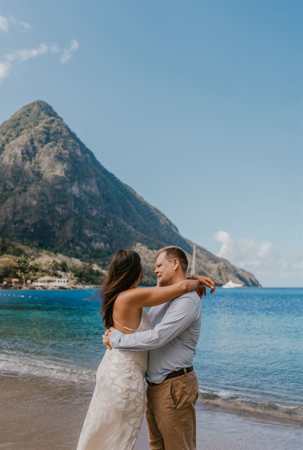couple embracing on sugar beach in saint lucia destination photography