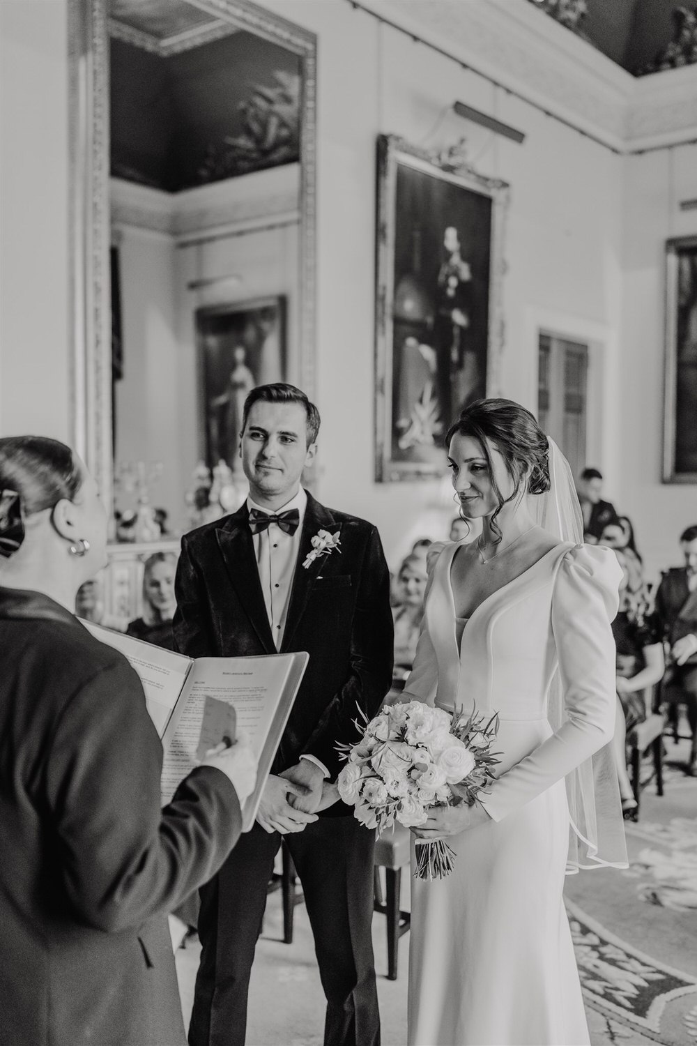 black and white photo of bride and groom during trinity house winter wedding in london