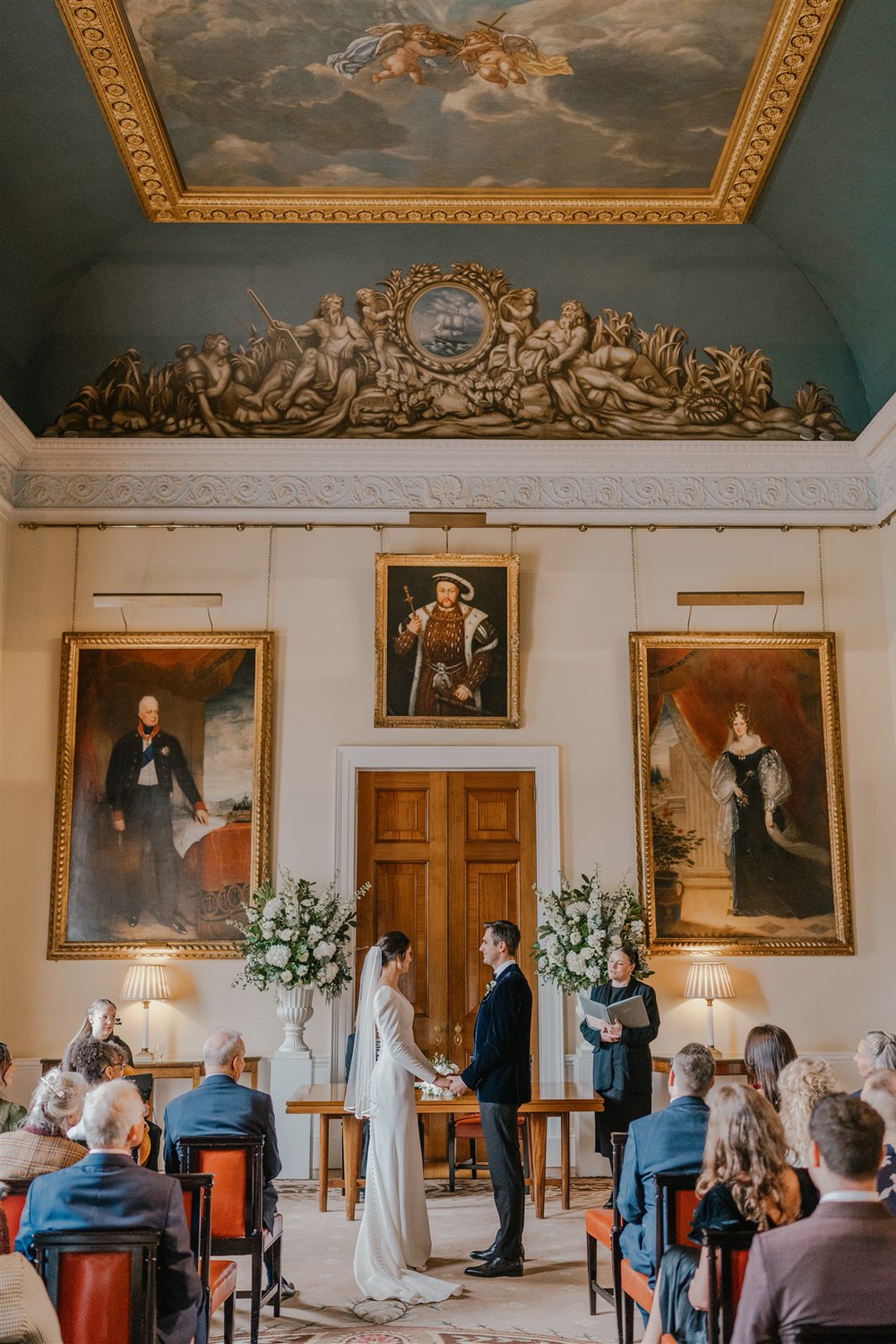 bride and groom say their vows at trinity house winter wedding in london