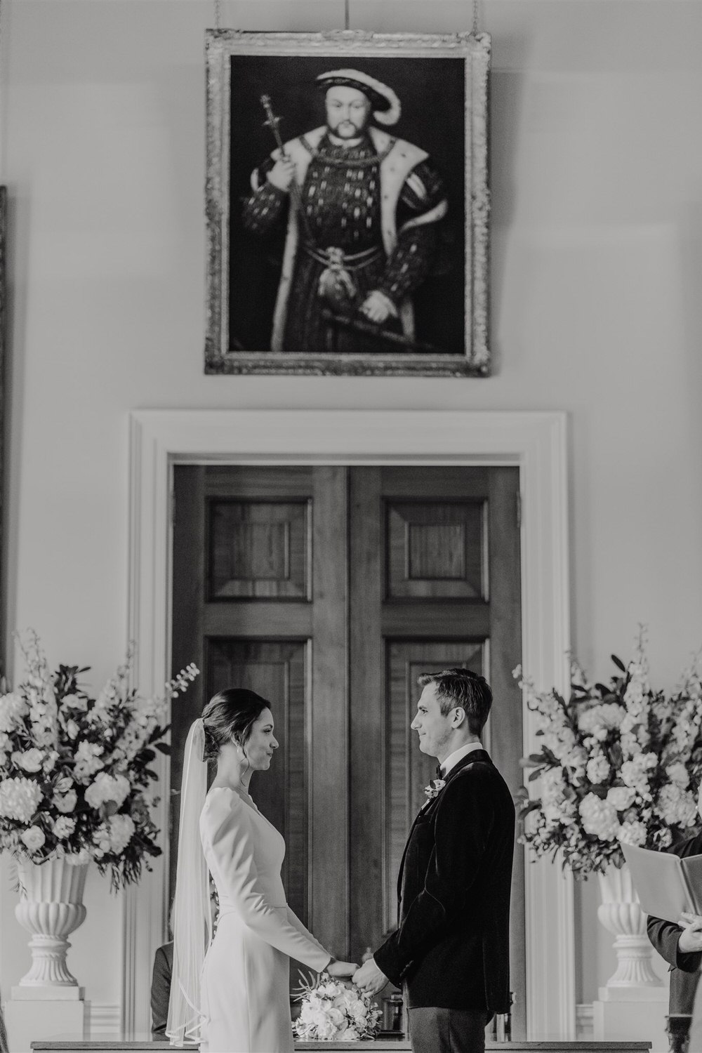 black and white photo of bride and groom saying their vows at trinity house winter wedding in london