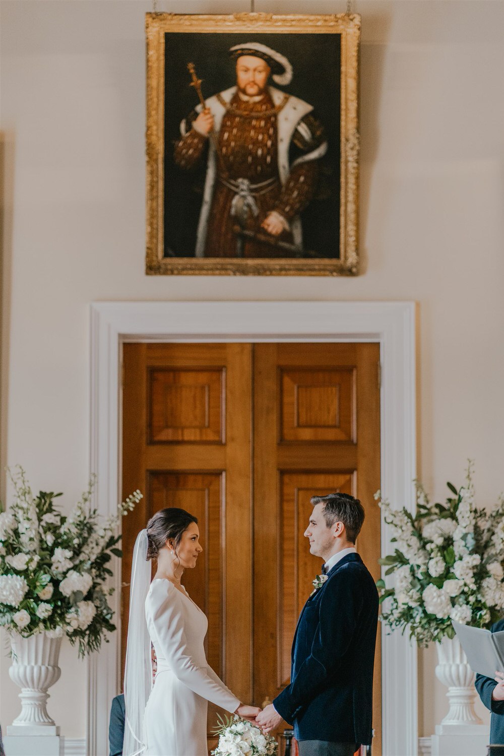 bride and groom say their vows at trinity house winter wedding in london