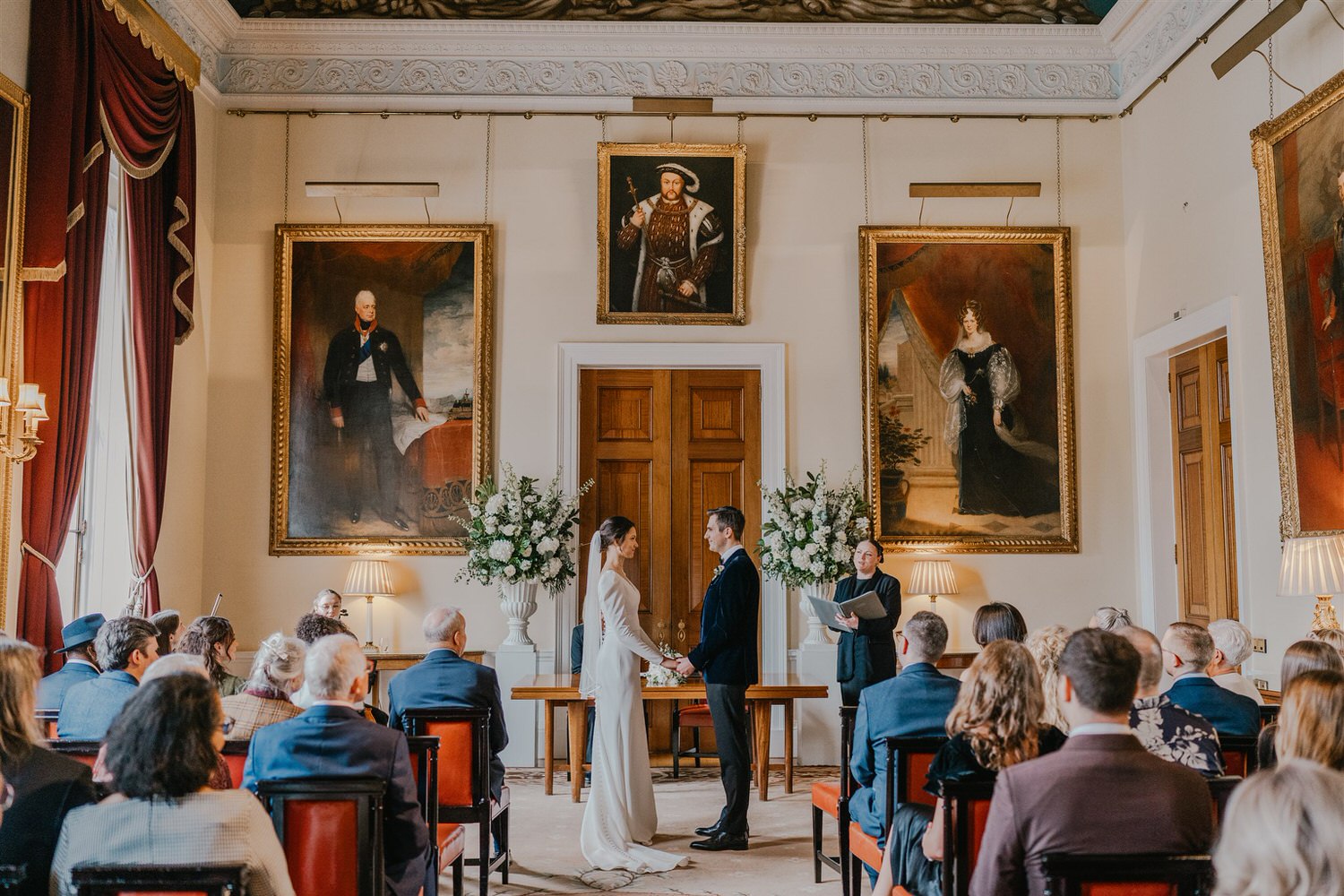 bride and groom say their vows at trinity house winter wedding in london