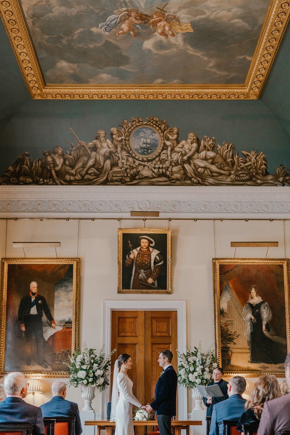 bride and groom say their vows at trinity house winter wedding in london