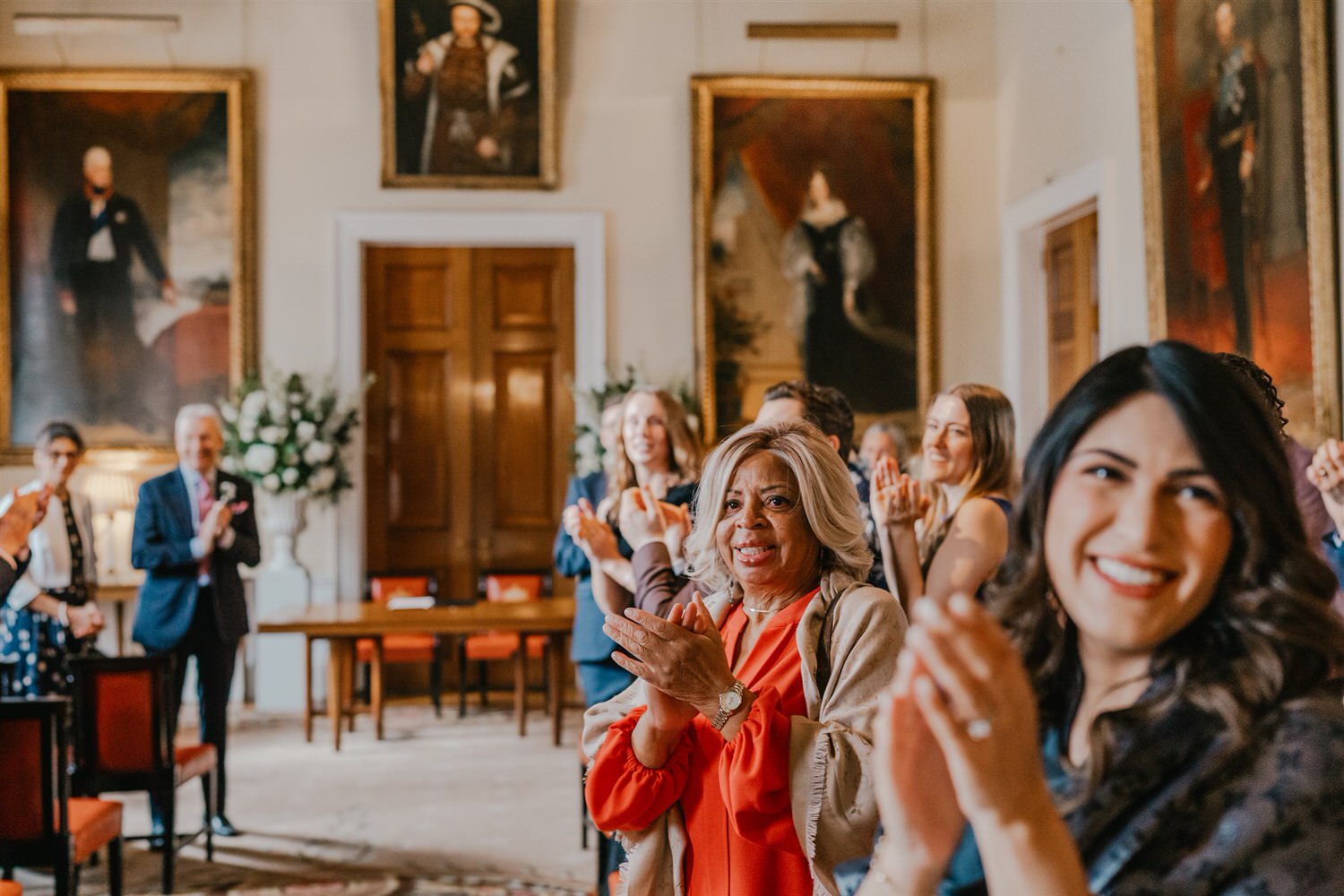 guests applaud bride and groom at trinity house winter wedding in london