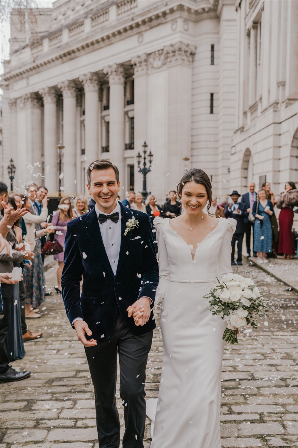 confetti tunnel outside trinity house winter wedding in london