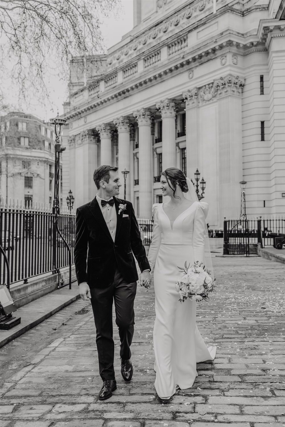 black and white bride and groom couple portraits outside trinity house in london