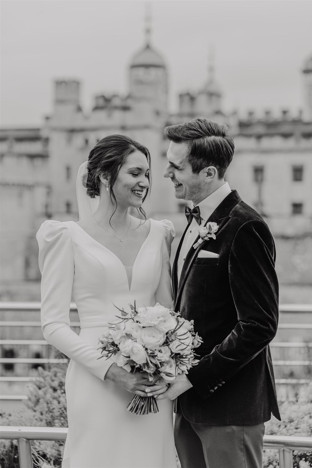 black and white bride and groom couple portraits outside tower of london